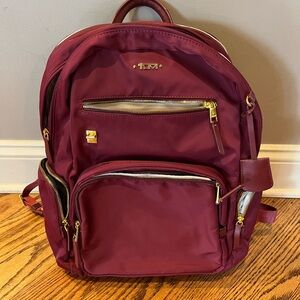 TUMI Maroon Backpack with Gold Accents